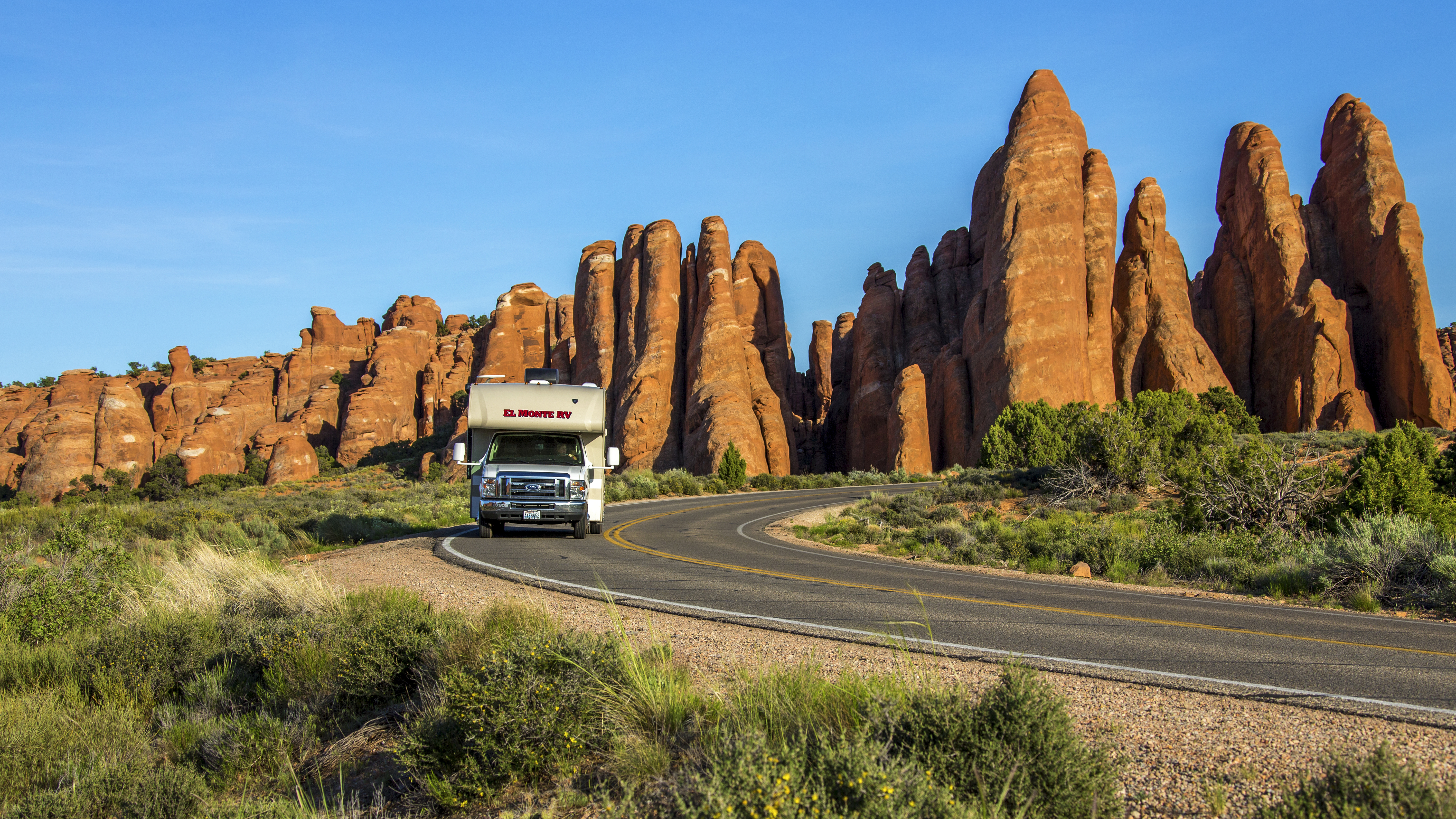 El Monte RV driving through Red Rocks, Utah. 