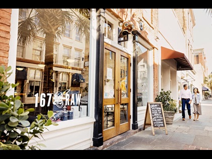 Couple walking into a Charleston, South Carolina, restaurant. 