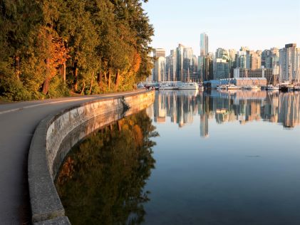 A curbed sidewalk along a pound in Stanley Park in Vancouver, British Columbia, Canada