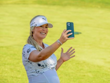 TV personality Blair O'Neal takes a video from the fairway at Viva! Las Vegas Pro-Am