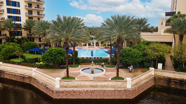 Aerial image of Owners biking along a beautiful walking path at Parc Soleil, a Hilton Grand Vacations Club, Orlando. 