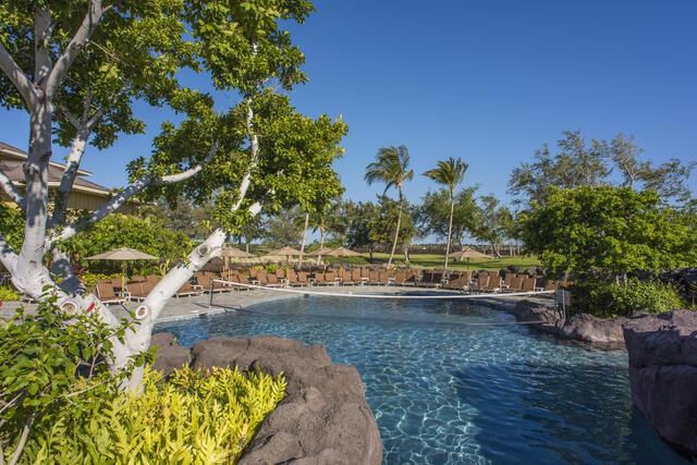 Idyllic tropical pool, volley ball net, Palm trees, blue skies, Kings' Land, a Hilton Grand Vacations Club, Big Island, Hawaii. 