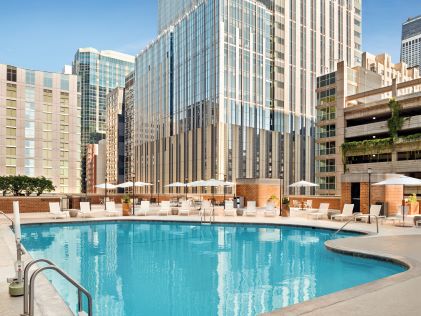 The pool at Chicago Magnificent Mile, a Hilton Grand Vacations Club in view of downtown Chicago skyscrapers