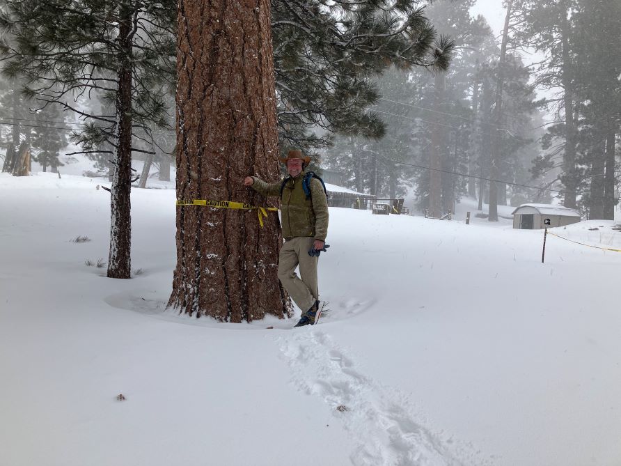 Hilton Grand Vacations Owner posing in snow, vacation picture. 