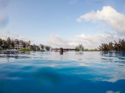 A Hilton Grand Vacations Owner at the pool at The Crane, a Hilton Grand Vacations Club in Barbados