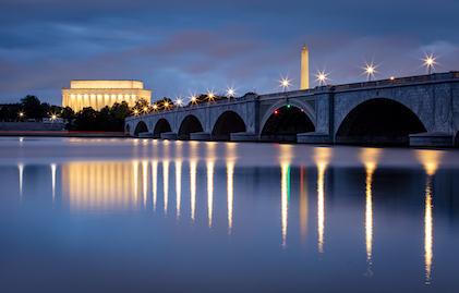 Twilight visual of the Arlington Memorial Bridge over the Potomac River with the National Mall in the background, Washington, D.C.