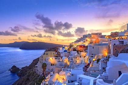 Santorini sunset at dusk in the small coastal village of Oia, Greece