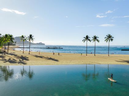 A paddleboarder near Waikiki Beach, Oahu, Hawaii