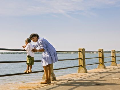 A mother and son walking along one of Charleston's waterways in South Carolina