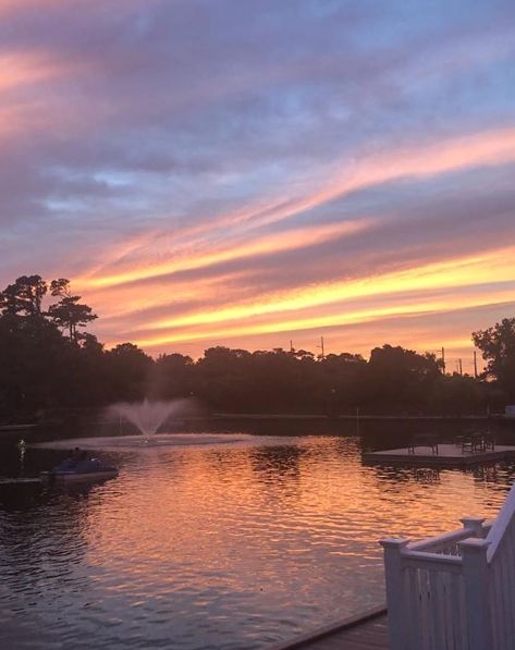 Sunset at a small pond at Board Resorts and Villas, a Hilton Vacation Club in Virginia Beach.